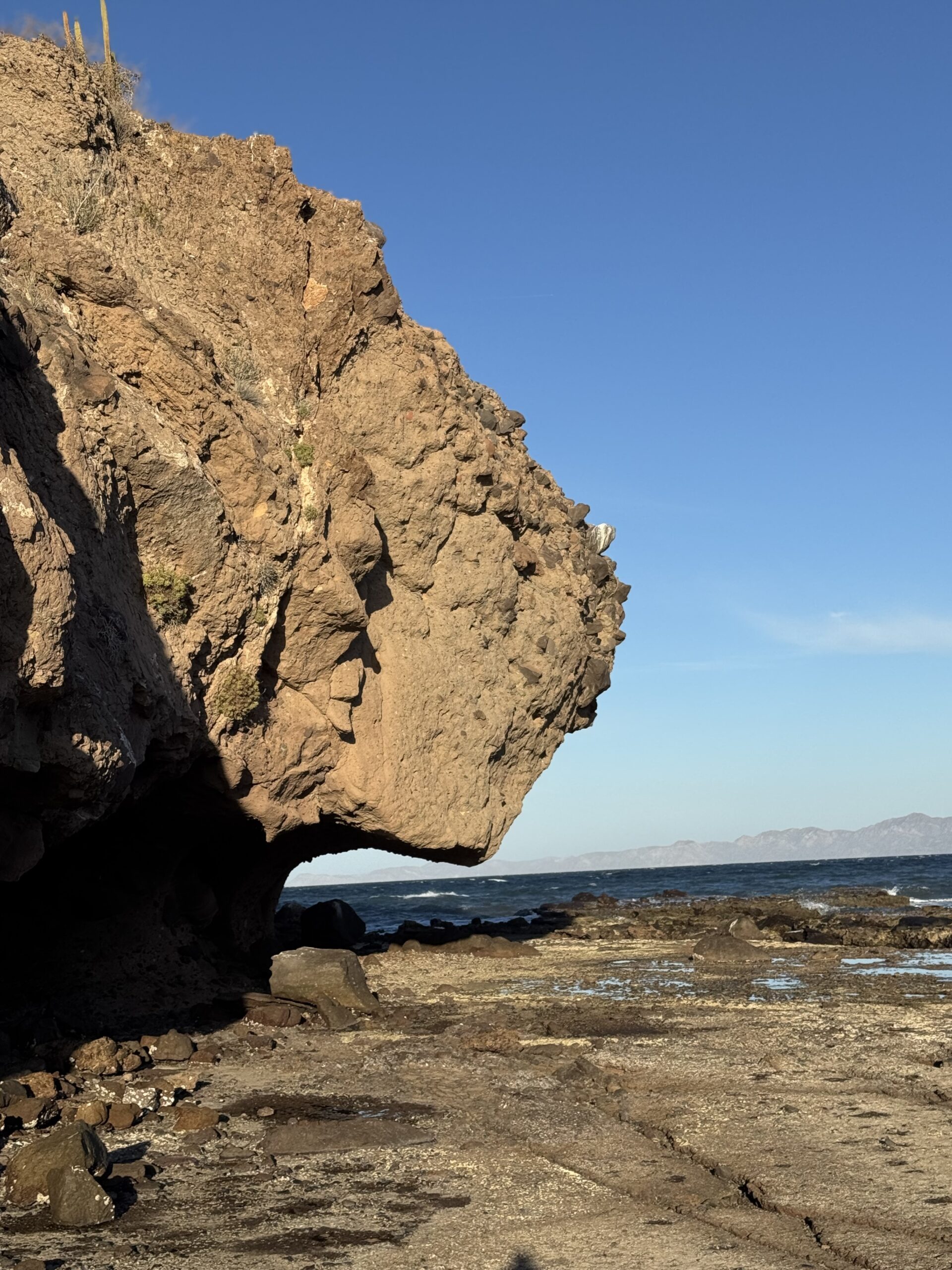 A dramatic coastal rock formation beside the Sea of Cortez, where the body of the shore meets geological deep time