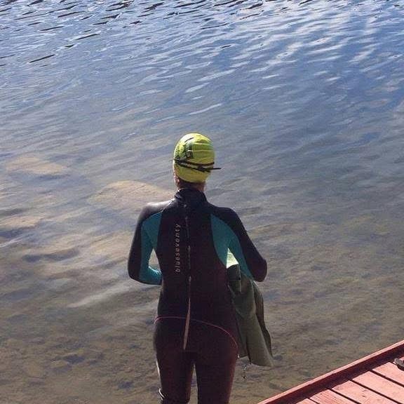 Ready to Enter - Open-water swimmer preparing to enter the lake
