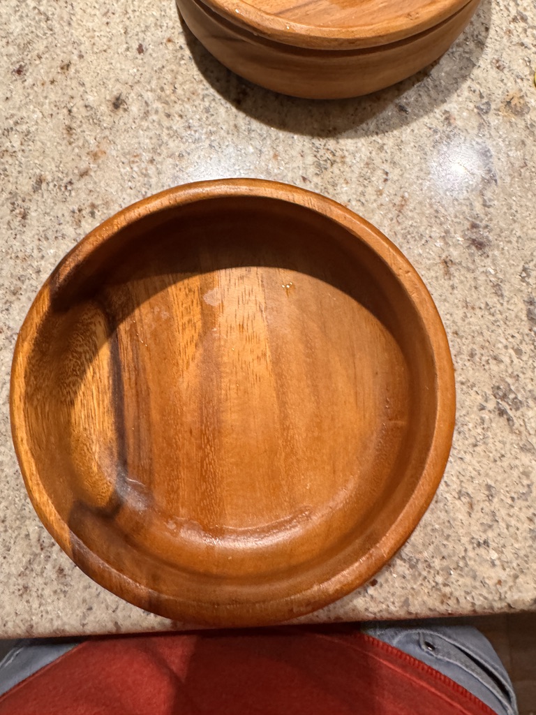 Wooden bowls on a granite countertop